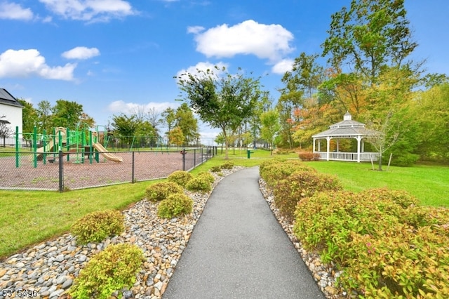 view of play area featuring a gazebo and a lawn