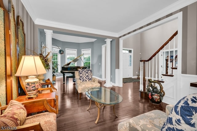 living room featuring ornamental molding, wood-type flooring, and ornate columns