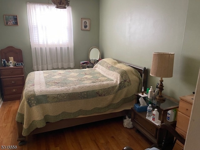 bedroom with hardwood / wood-style floors