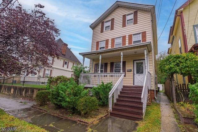 view of property featuring a porch