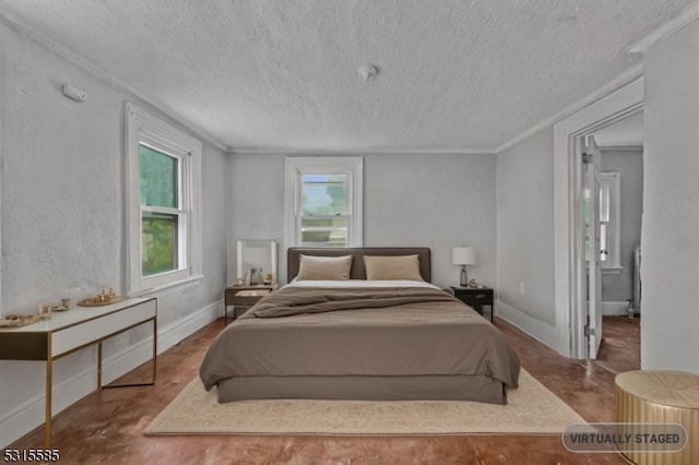 bedroom with a textured ceiling and ornamental molding