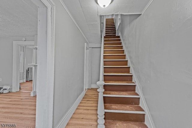 staircase featuring hardwood / wood-style flooring