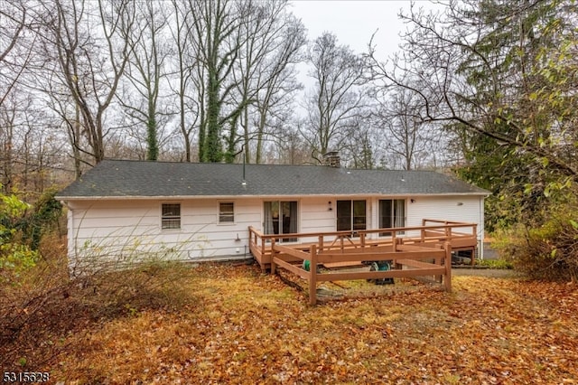 rear view of house featuring a deck