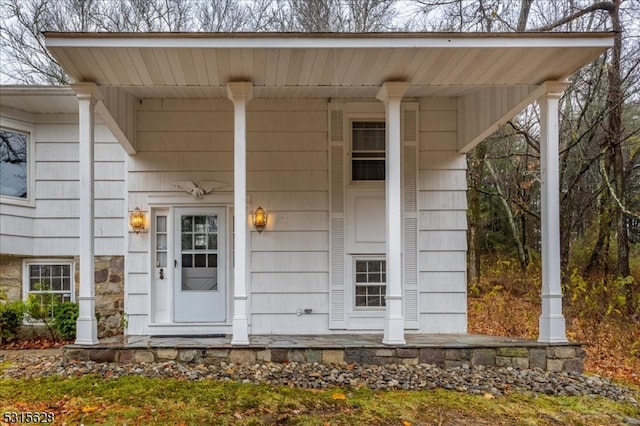 doorway to property featuring a porch