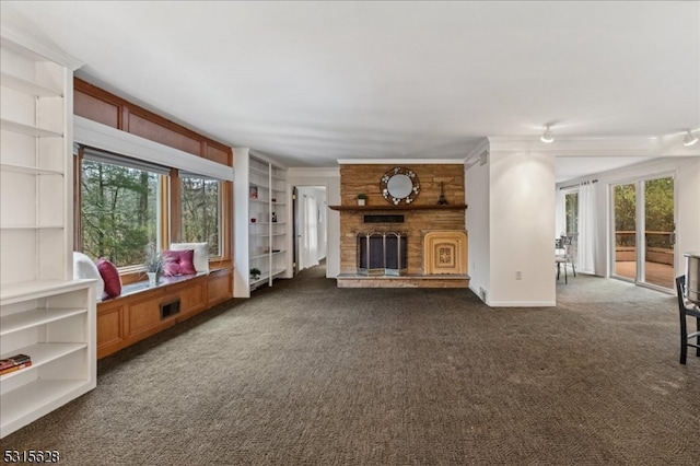 unfurnished living room with dark carpet and a brick fireplace