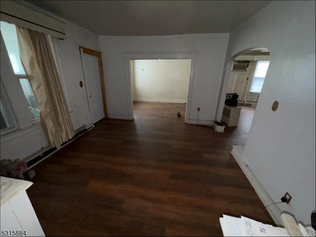 corridor featuring dark wood-type flooring