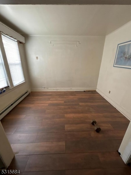 spare room with dark hardwood / wood-style floors