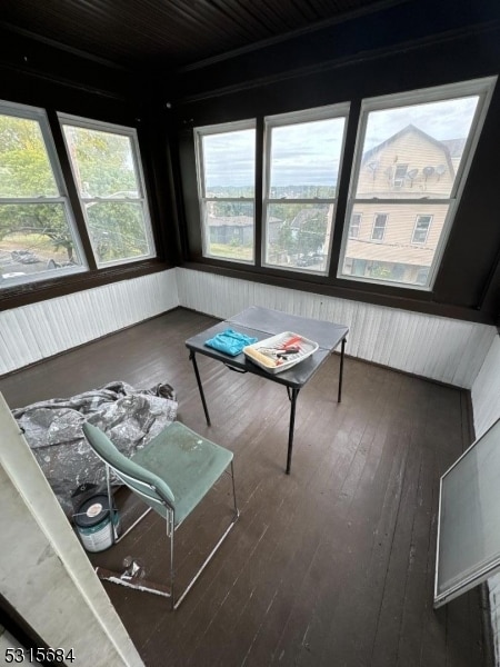 unfurnished living room featuring dark hardwood / wood-style floors