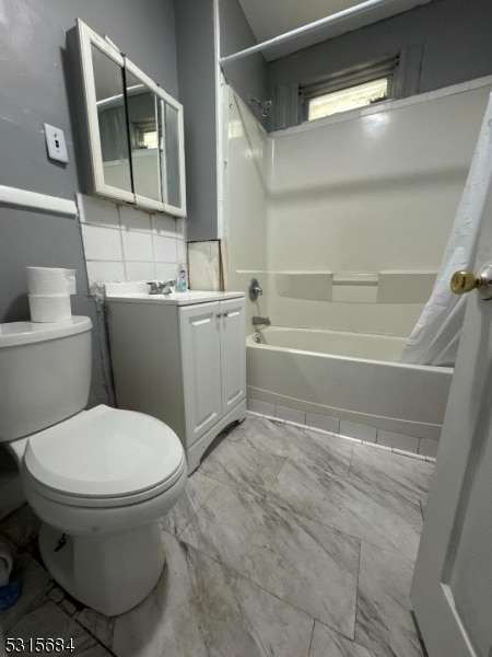 full bathroom with shower / bathtub combination with curtain, vanity, and toilet