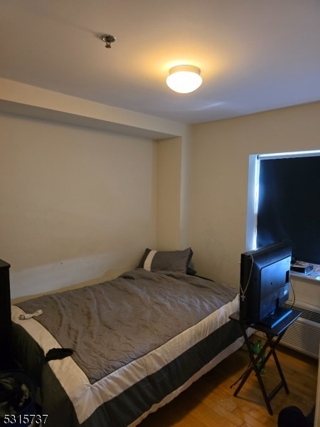 bedroom featuring hardwood / wood-style floors