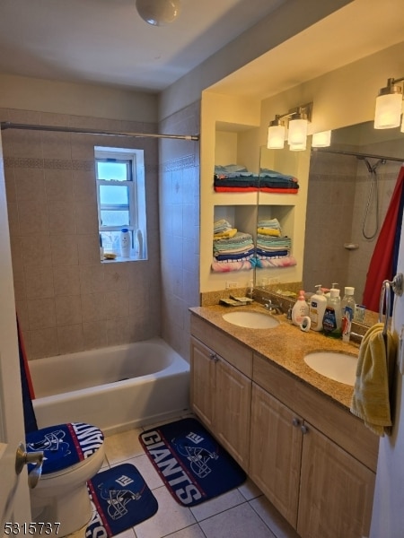 full bathroom featuring shower / tub combo with curtain, tile patterned floors, vanity, and toilet