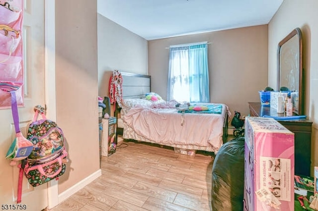 bedroom featuring light wood-type flooring