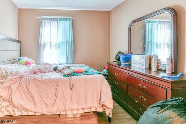 bedroom with light hardwood / wood-style floors