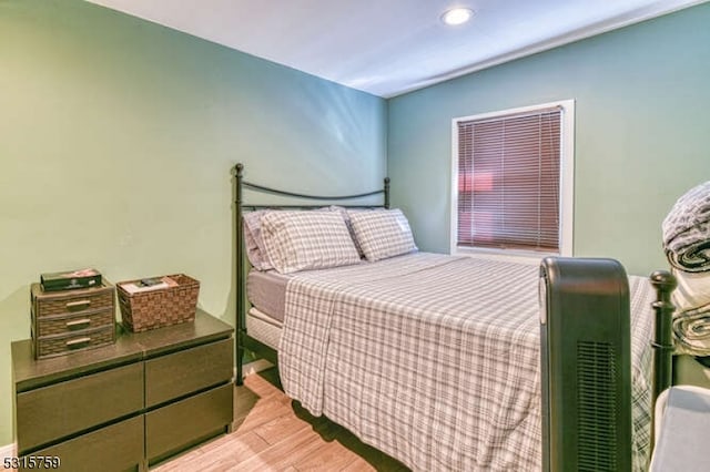 bedroom with light hardwood / wood-style flooring