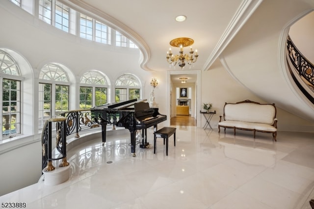 misc room featuring an inviting chandelier and crown molding