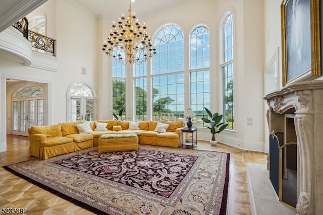 sunroom / solarium featuring an inviting chandelier and a premium fireplace