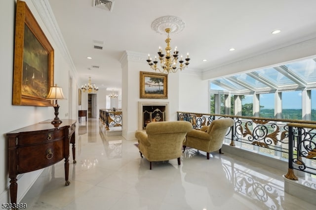 sitting room featuring an inviting chandelier and ornamental molding