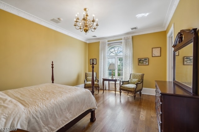 bedroom featuring an inviting chandelier, dark hardwood / wood-style floors, and crown molding