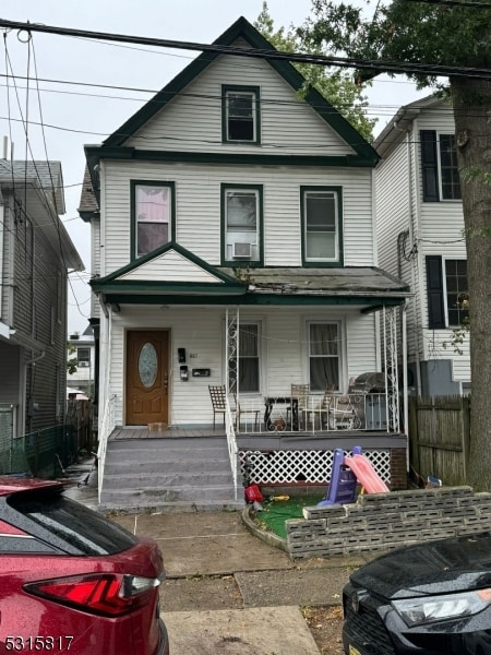 view of property featuring a porch