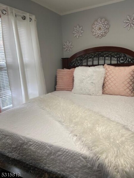 bedroom featuring ornamental molding