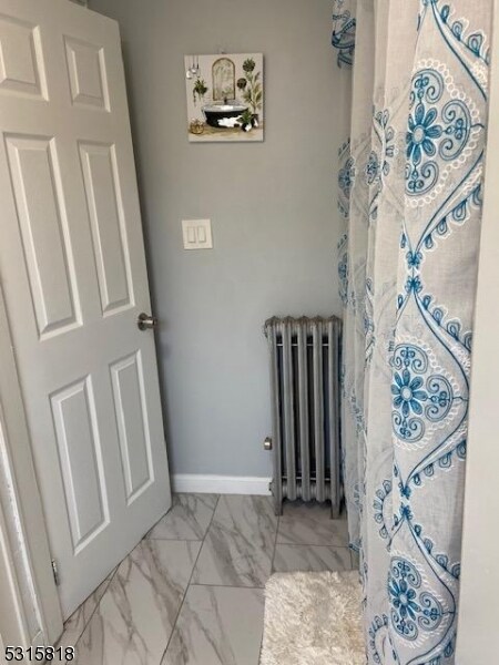 bathroom with radiator heating unit