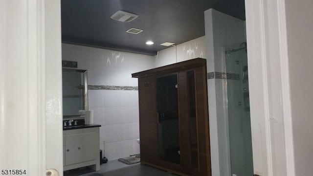 bathroom featuring vanity and walk in shower