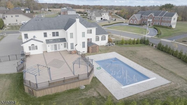 view of swimming pool with a storage shed