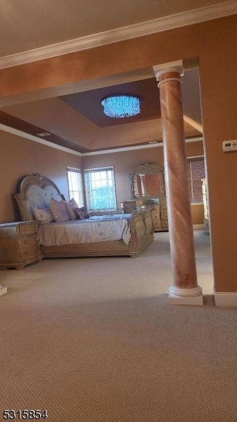 unfurnished bedroom featuring carpet floors, ornate columns, and crown molding