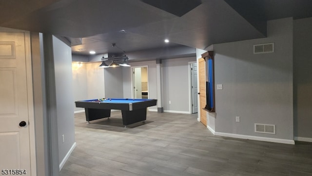 game room with hardwood / wood-style floors and pool table