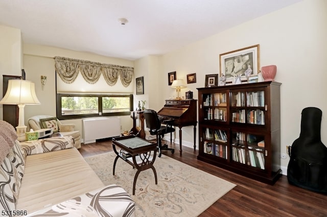 living room featuring radiator and dark hardwood / wood-style flooring