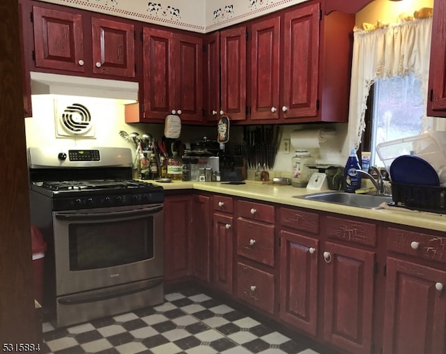 kitchen featuring gas range and sink