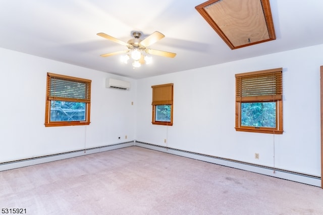 unfurnished room featuring a baseboard radiator, a wall unit AC, ceiling fan, and a healthy amount of sunlight