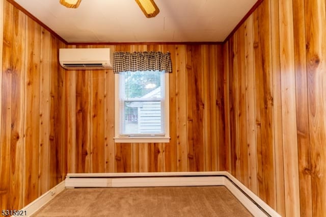 unfurnished room featuring an AC wall unit, wood walls, ceiling fan, and carpet flooring