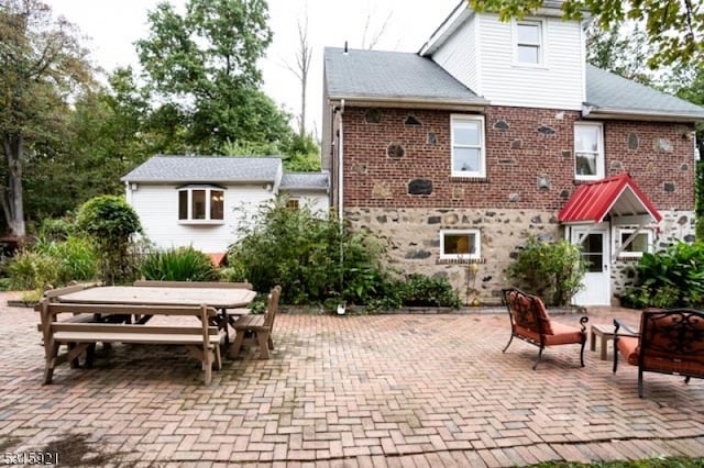 rear view of property with a patio