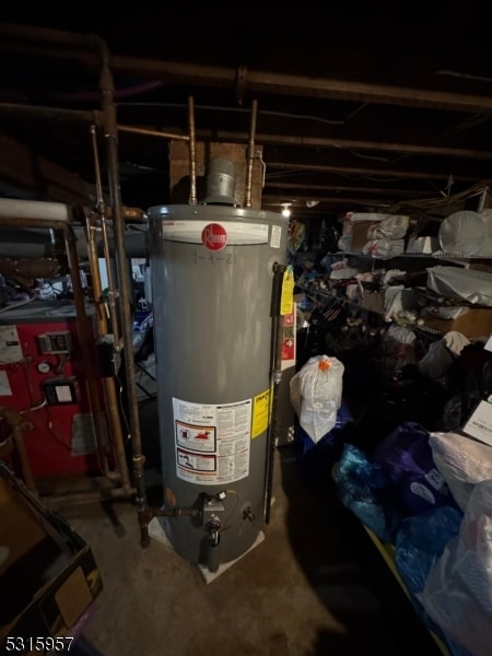 utility room featuring gas water heater