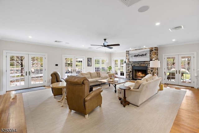 living room with a healthy amount of sunlight and french doors