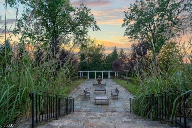 view of home's community featuring a patio area