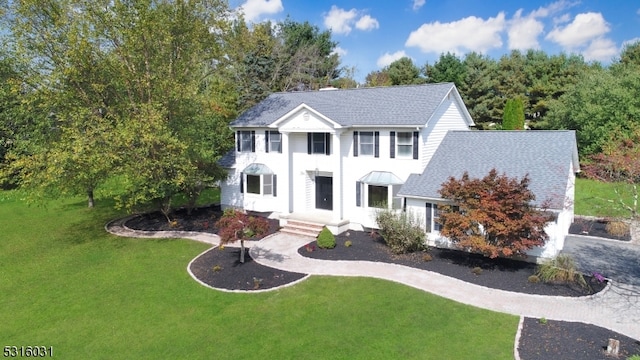 view of front of house with a front lawn