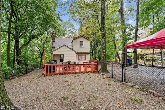 back of house featuring a deck