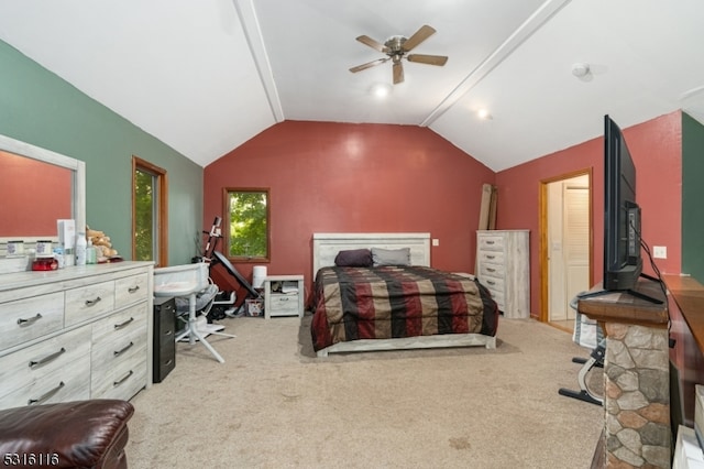 bedroom with vaulted ceiling, ceiling fan, and light carpet