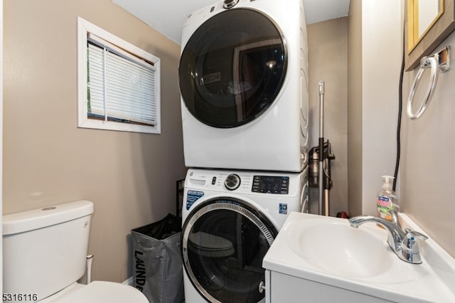 laundry room with sink and stacked washing maching and dryer