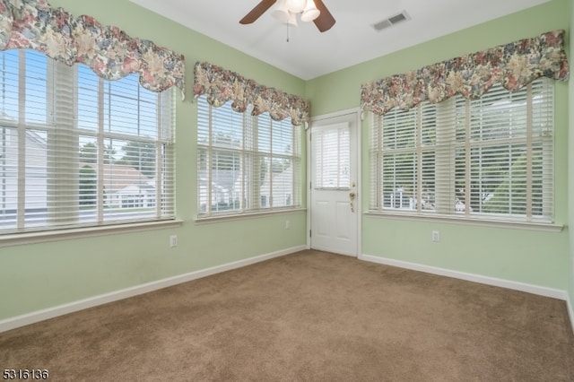 carpeted empty room with ceiling fan