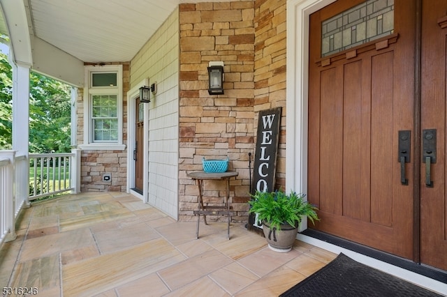 doorway to property featuring a porch