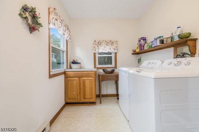 washroom featuring washer and dryer, light colored carpet, and cabinets