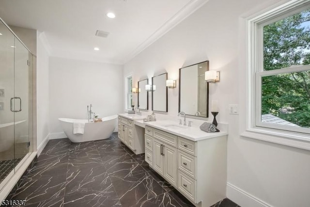 bathroom featuring vanity, ornamental molding, and separate shower and tub