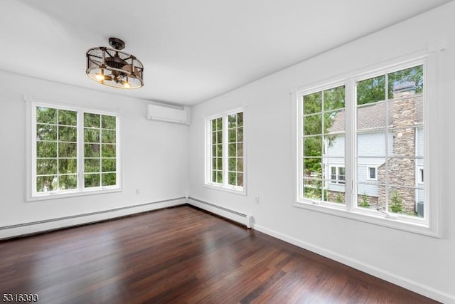 spare room featuring baseboard heating, a wall mounted air conditioner, baseboards, an inviting chandelier, and dark wood-style floors