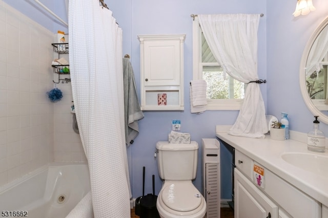 full bathroom featuring shower / tub combo with curtain, vanity, and toilet