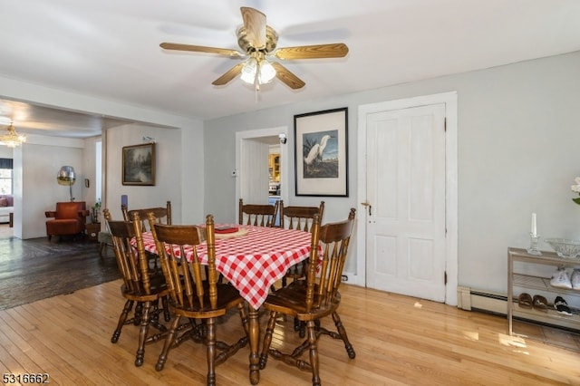 dining area featuring light hardwood / wood-style floors and ceiling fan