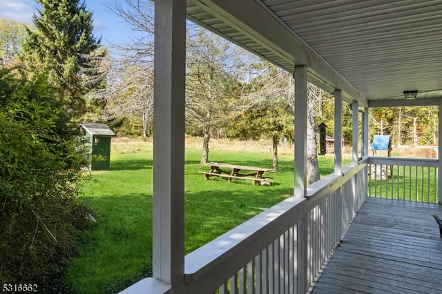 wooden terrace with a yard