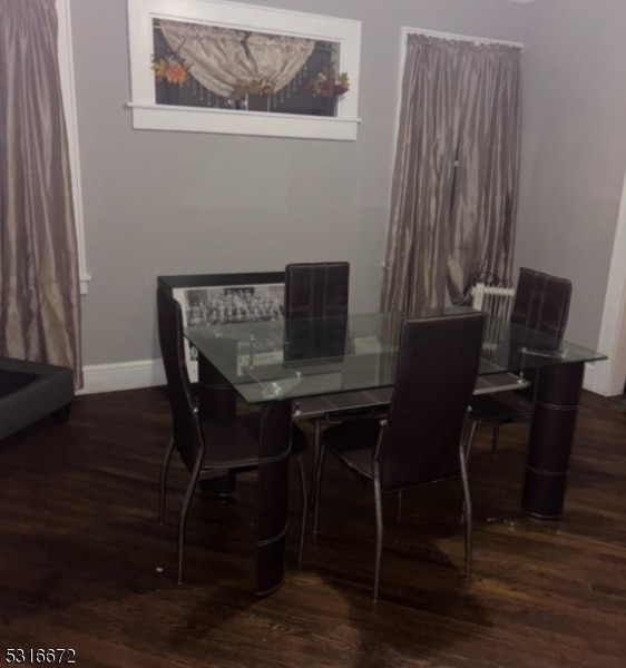 dining area featuring dark hardwood / wood-style flooring